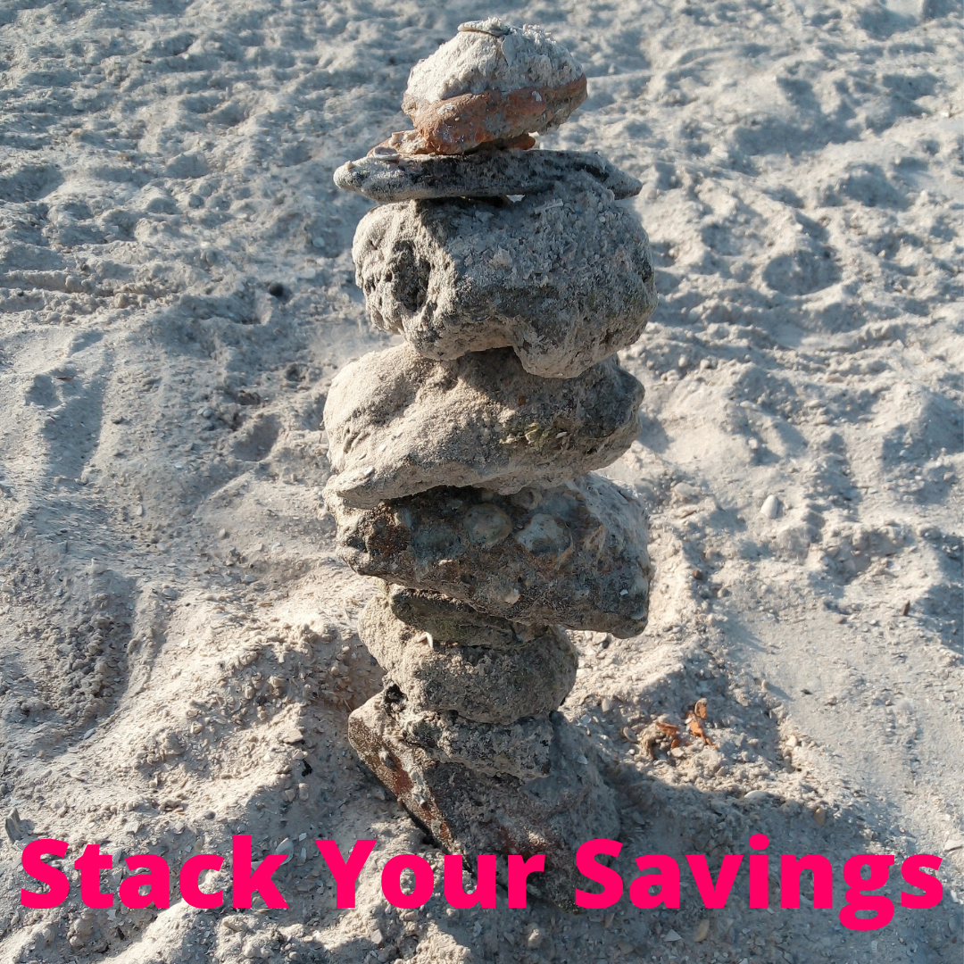 Stack Your Savings image stacked beach rocks